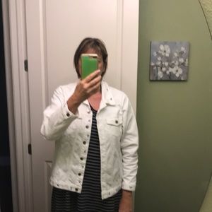 L white jean style jacket with embroidered flowers around cuffs, bottom & front